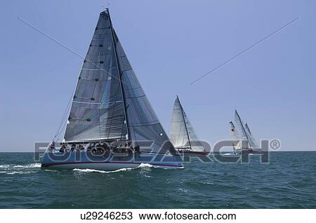 Stock Image - Yachts compete in team sailing event California. Fotosearch