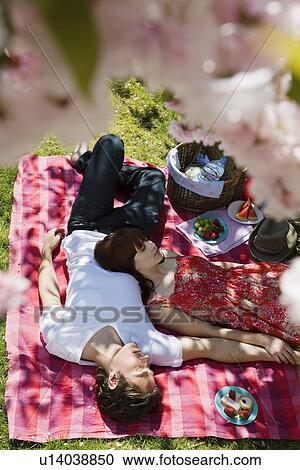 Young Couple Having a Picnic View Large Photo Image Stock Image - Young Couple Having a Picnic. Fotosearch