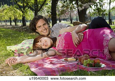 Young Couple Having a Picnic View Large Photo Image Stock Image - Young Couple Having a Picnic. Fotosearch