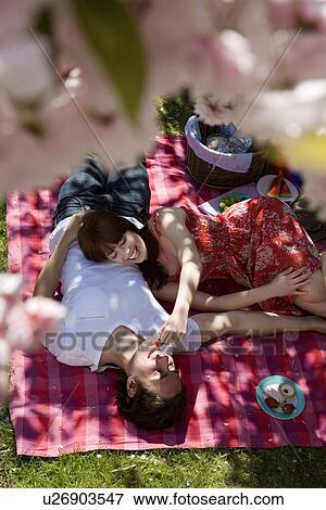 Young Couple Having a Picnic View Large Photo Image Stock Photo - Young Couple Having a Picnic. Fotosearch