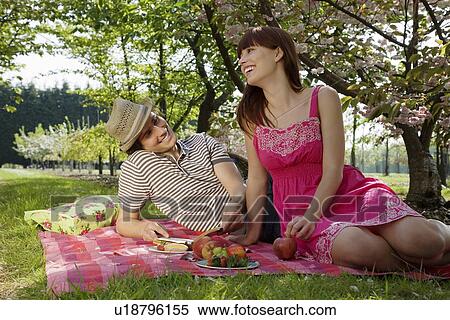 Stock Photography - Young Couple Having a Picnic. Fotosearch