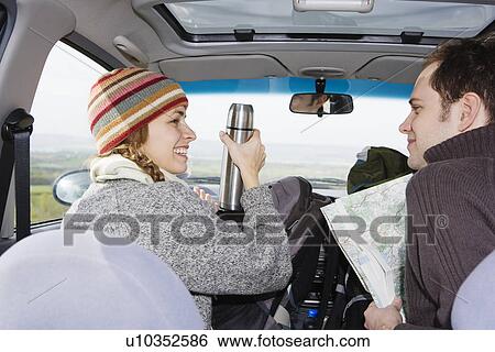 Stock Photograph - Young Couple on a Road Trip. Fotosearch