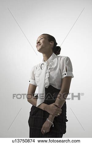 Picture - Young elegant woman smiling studio shot. Fotosearch