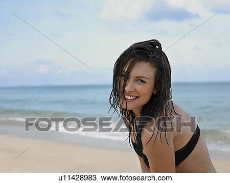 Stock Image - Young Woman at Beach. Fotosearch