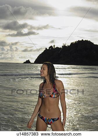 Stock Image - Young Woman at Beach. Fotosearch