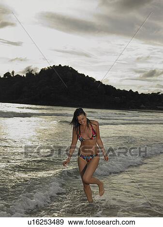 Stock Photo - Young Woman at Beach. Fotosearch