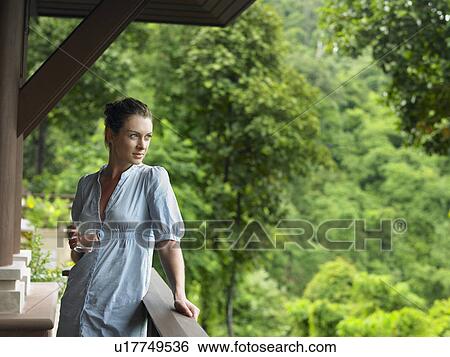 Young Woman Beneath Veranda View Large Photo Image Stock Photograph - Young Woman Beneath Veranda. Fotosearch