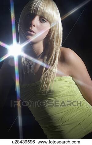 Young woman dancing in disco View Large Photo Image Stock Photograph - Young woman dancing in disco. Fotosearch