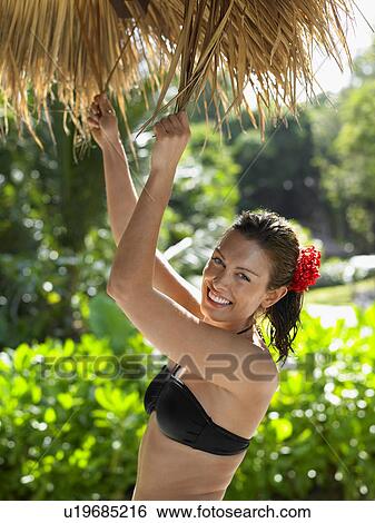 Young Woman in Bikini with Flower in Hair View Large Photo Image Stock Photograph - Young Woman in Bikini with Flower in Hair. Fotosearch