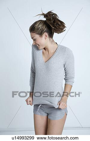 Stock Photo - Young woman jumping. Fotosearch