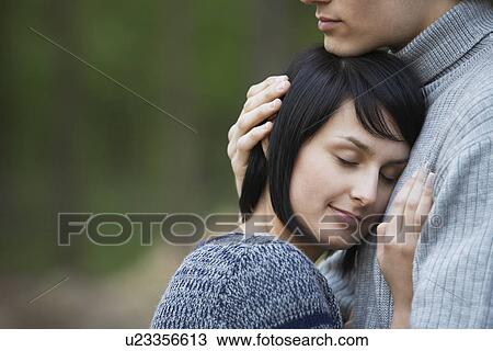 Young Woman Laying Head on Chest of Young Man View Large Photo Image Stock Image - Young Woman Laying Head on Chest of Young Man. Fotosearch