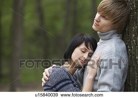 Young Woman Laying Head on Chest of Young Man View Large Photo Image Stock Photo - Young Woman Laying Head on Chest of Young Man. Fotosearch