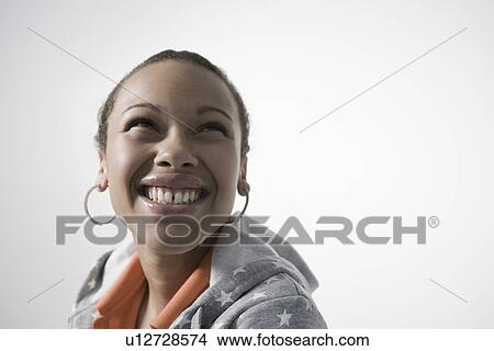 Young woman smiling close-up view View Large Photo Image Picture - Young woman smiling close-up view. Fotosearch