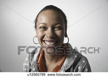 Stock Photo - Young woman smiling close-up view. Fotosearch