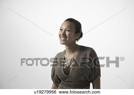 Stock Photograph - Young woman smiling close-up view. Fotosearch
