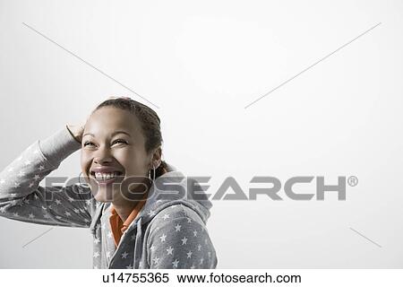 Stock Photography - Young woman smiling close-up view. Fotosearch