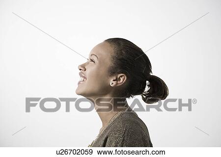 Young woman smiling profile close-up view View Large Photo Image Stock Photo - Young woman smiling profile close-up view. Fotosearch