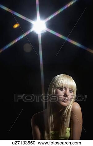 Young woman standing in disco View Large Photo Image Stock Image - Young woman standing in disco. Fotosearch