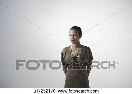 Young woman studio shot View Large Photo Image Stock Image - Young woman studio shot. Fotosearch