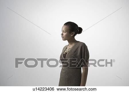 Stock Photograph - Young woman studio shot. Fotosearch