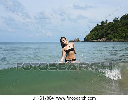 Young Woman Wading in Ocean View Large Photo Image Picture - Young Woman Wading in Ocean. Fotosearch