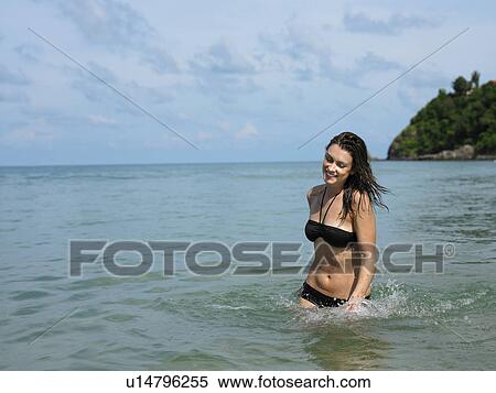 Young Woman Wading in Ocean View Large Photo Image Stock Photography - Young Woman Wading in Ocean. Fotosearch