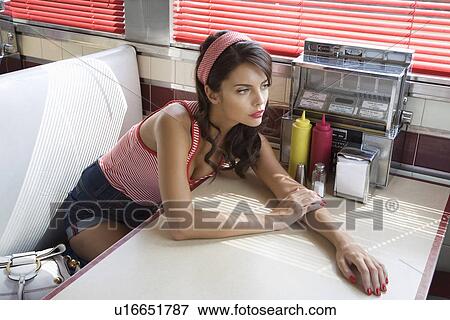 Young Woman Waiting in a Diner View Large Photo Image Stock Photo - Young Woman Waiting in a Diner. Fotosearch