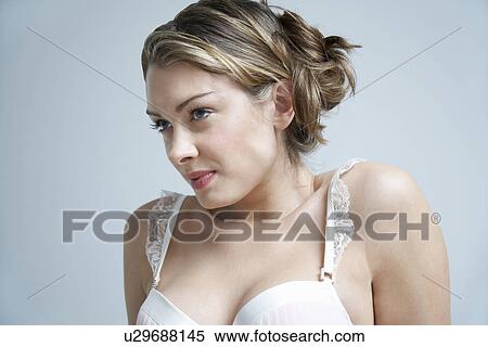 Young woman wearing bra close-up View Large Photo Image Stock Photography - Young woman wearing bra close-up. Fotosearch
