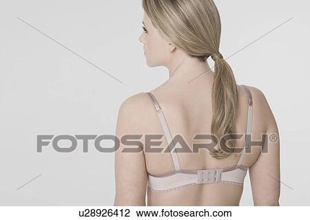 Young woman wearing bra rear view View Large Photo Image Stock Image - Young woman wearing bra rear view. Fotosearch