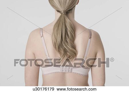 Young woman wearing bra rear view View Large Photo Image Stock Photo - Young woman wearing bra rear view. Fotosearch