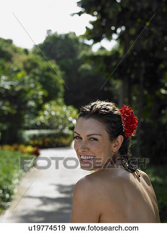 Young Woman with Flower in Hair View Large Photo Image Stock Photo - Young Woman with Flower in Hair. Fotosearch