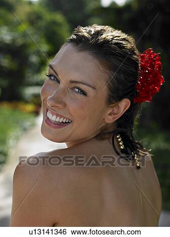 Young Woman with Flower in Hair View Large Photo Image Stock Photograph - Young Woman with Flower in Hair. Fotosearch