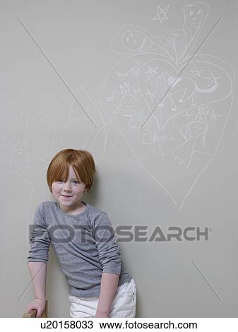 7-8 Year old girl stands below chalk drawing on wall View Large Photo Image Stock Image - 7-8 Year old girl stands below chalk drawing on wall. Fotosearch