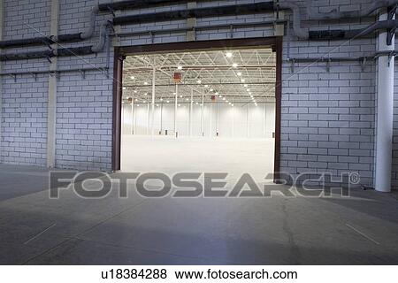 Stock Photo - Access door to empty warehouse. Fotosearch
