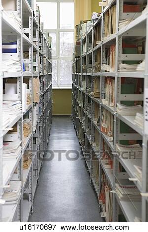 Stock Photo - Aisle of books in library. Fotosearch