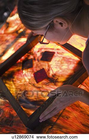 Artist producing textiles close-up View Large Photo Image Picture - Artist producing textiles close-up. Fotosearch