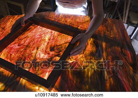 Stock Photography - Artist producing textiles close-up. Fotosearch