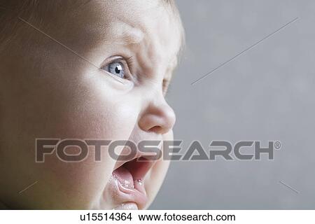 Picture - Baby girl crying close-up. Fotosearch