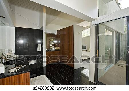 Stock Image - Bathroom in modern residence. Fotosearch