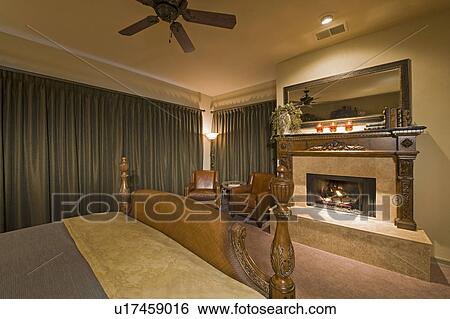 Stock Photograph - Bedroom interior with fireplace. Fotosearch