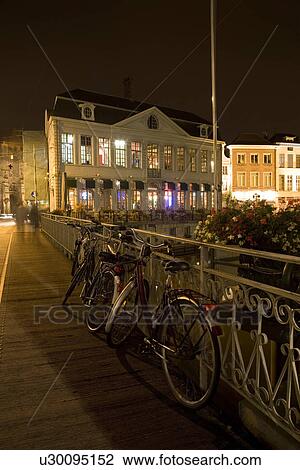Stock Image - Bicycles on bridge . Fotosearch