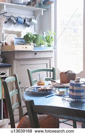 Stock Photo - Bread and butter or breakfast table in rural kitchen. Fotosearch