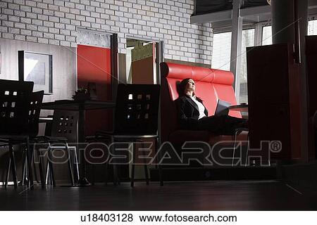 Business woman using laptop in cafe View Large Photo Image Stock Photo - Business woman using laptop in cafe. Fotosearch