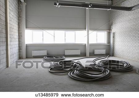 Cable wires in empty room warehouse View Large Photo Image Stock Photo - Cable wires in empty room warehouse. Fotosearch