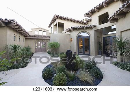 Stock Photo - cactus garden and courtyard of Palm Springs home. Fotosearch