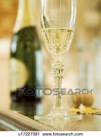 Stock Image - Champagne glass and bottle. Fotosearch