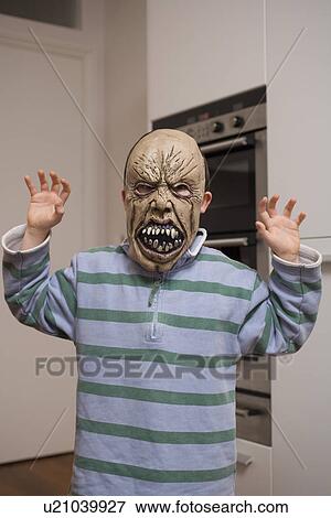 Child wearing mask in kitchen View Large Photo Image Stock Photo - Child wearing mask in kitchen. Fotosearch