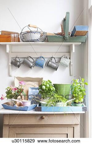 Stock Photo - Cups and trays on kitchen dresser. Fotosearch