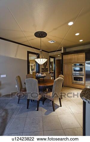 Stock Image - Dining room and kitchen. Fotosearch