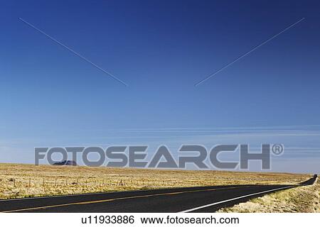Stock Photograph - Empty road in desert USA. Fotosearch